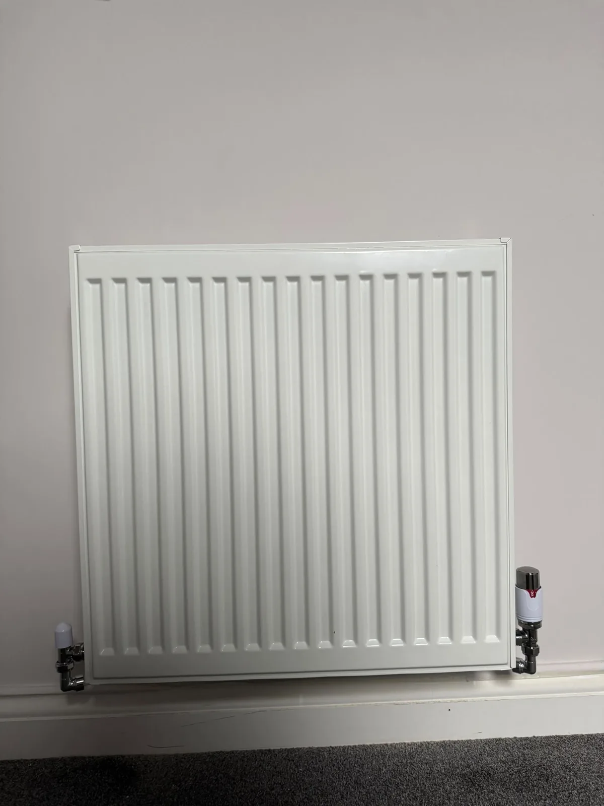 Finished radiator fitted as part of central heating work by HB Group